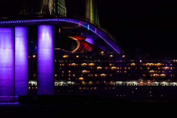Cruise ship’s “Whale Tail” under the illuminated Sunshine Skyway Bridge thumbnail