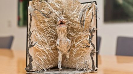 A tyrannosaur bursts from the pages of Arthur Conan Doyle's 'The Lost World'