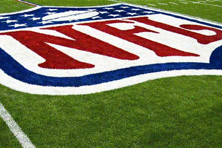The NFL logo on the 50 yard line