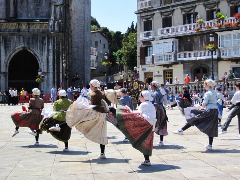 A Group Of Basque Girls Dressed In The Traditional Attire Of Their