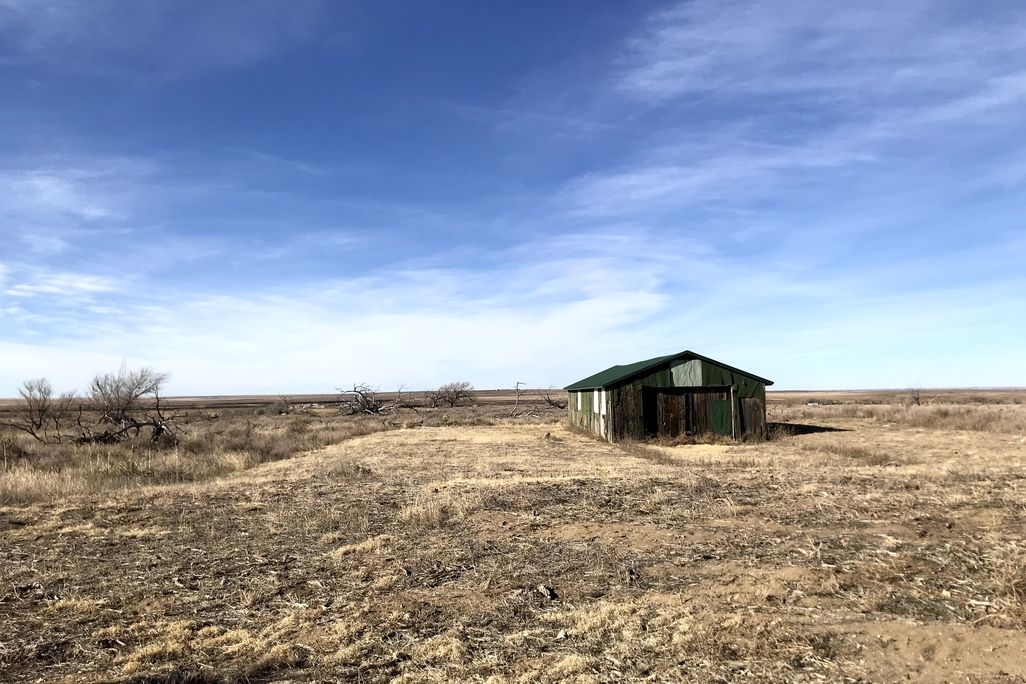Old green building at the site of the former Granada Relocation Center in Colorado