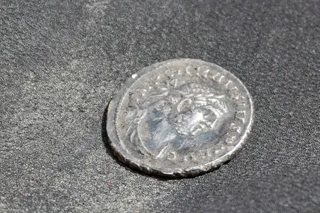 Minted by Carausius, this silver denarius is dated to 287 C.E.