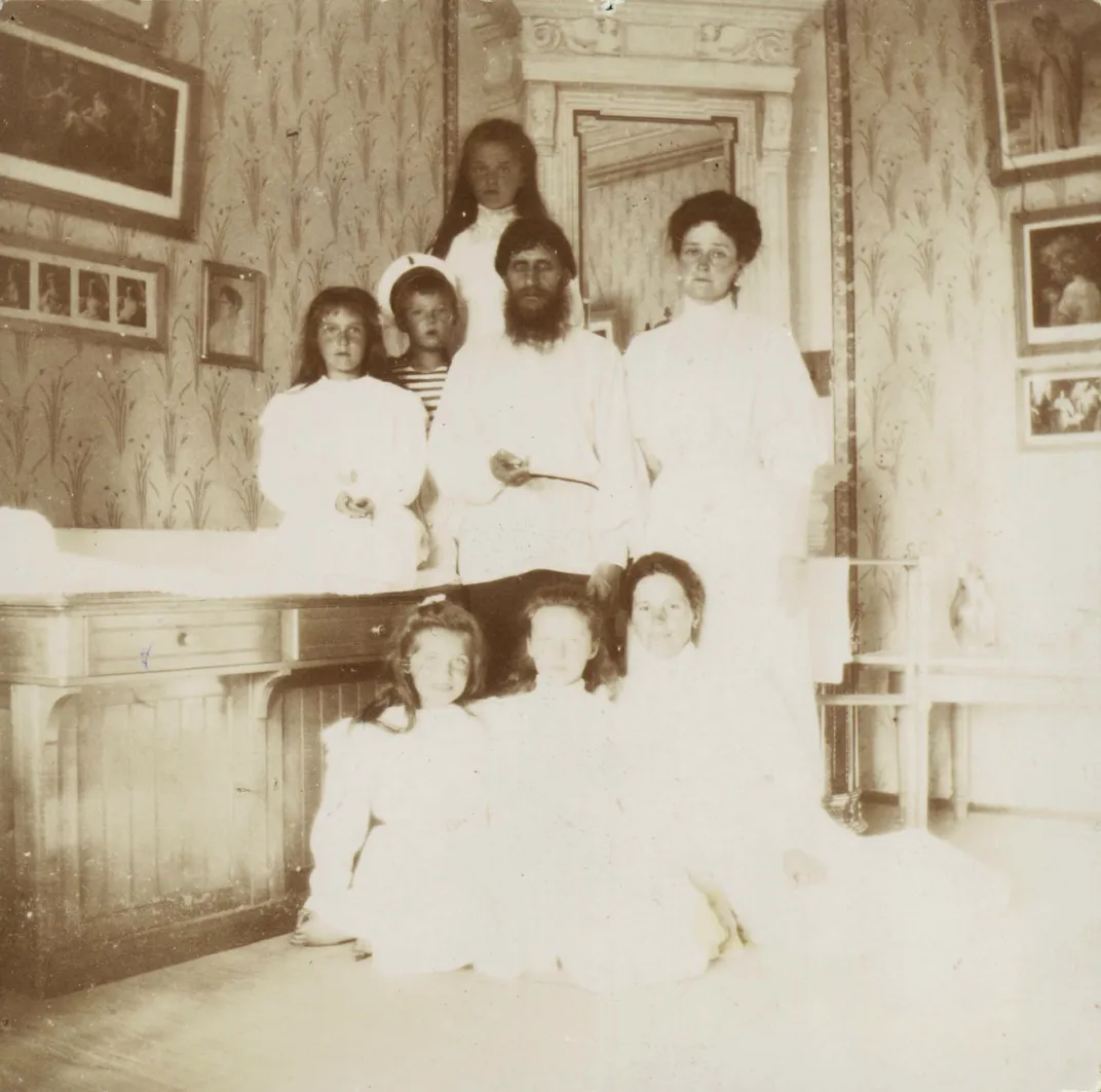 Alexandra and the Romanov children with Grigori Rasputin and a governess in 1908