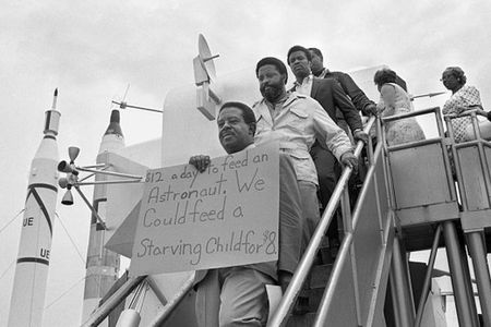 Reverend Ralph Abernathy, Hosea Williams and other members of the SCLC Poor People's Campaign march through the lunar lander exhibit at Kennedy Space Center before the launch of Apollo 11.