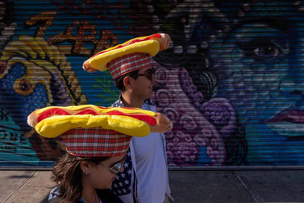 two spectators of Nathan's Annual Hot Dog Eating Contest
