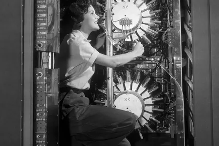 Computer technician Joyce Cade works on a UNIVAC computer at a United States Census Bureau installation in Maryland which was used to tabulate the results of the 1954 Census of Business.