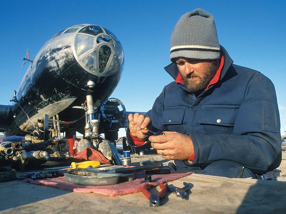 man in beanie rebuilding cowl flap motors