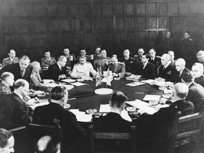 A conference session including Clement Attlee, Ernest Bevin, Vyacheslav Mikhailovich Molotov, Joseph Stalin, William D. Leahy, Joseph E. Davies, James F. Byrnes, and Harry S. Truman.