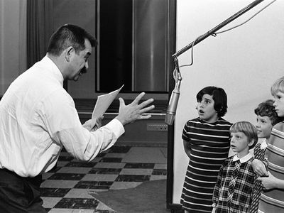 Producer Lee Mendelson directs children who are recording the dialogue for the animated TV special "It's the Great Pumpkin, Charlie Brown."