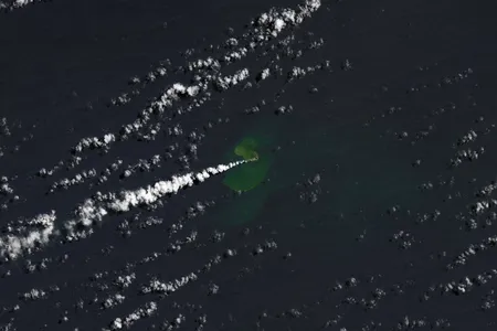 A NASA Earth Observatory satellite captured an image of the eruption on September 14. The greener, discolored water near the eruption site likely contains particulate matter, rock fragments and sulfur from the volcano.&nbsp;