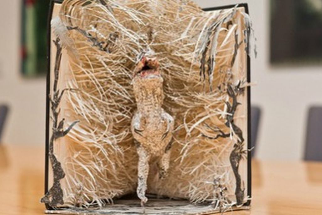 A tyrannosaur bursts from the pages of Arthur Conan Doyle's 'The Lost World'