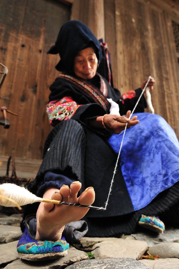 Old Miao woman yearning wool. thumbnail