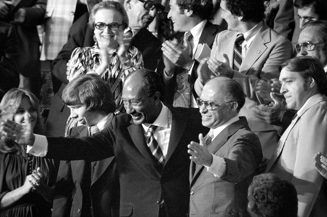 Egyptian President Anwar Sadat and Israeli Prime Minister Menachem Begin acknowledge applause during a joint session of Congress in September 1978.