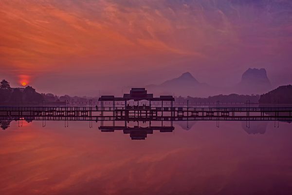 The photo is show sunrise and mountain.