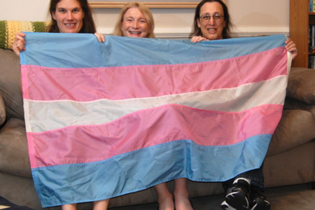 Transgender flag designed by Monica Helms (right), and friends. The flag's stripes represent the traditional pink and blue associated with girls and boys and white for intersex, transitioning, or of undefined gender. Helms served in the United States Navy and became an activist for transgender rights in the late 1990s in Arizona where she grew up. She designed the flag in 1999. (NMAH)