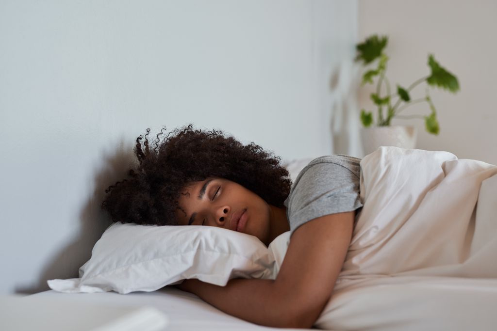 A young women asleep in bed