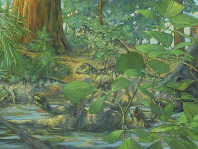 Reconstruction of the nesting ground of Hypacrosaurus stebingeri from the Two Medicine formation of Montana. In the center can be seen a deceased Hypacrosaurus nestling with the back of its skull embedded in shallow waters. A mourning adult is portrayed on the right. 