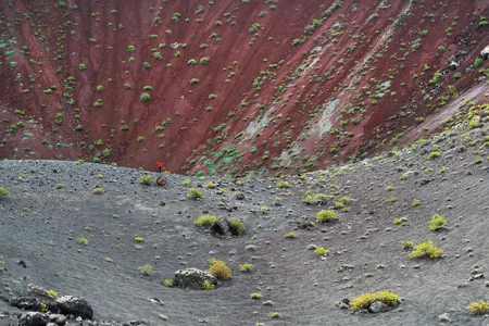 Thirteen-year-old Pedro de Frutos stands inside a dormant volcano near Timanfaya National Park. A series of eruptions
began in 1730 and lasted six years.