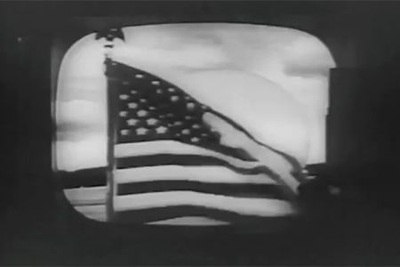 An American flag waving in Andover, Maine. This was the first video ever transmitted by commercial satellite.