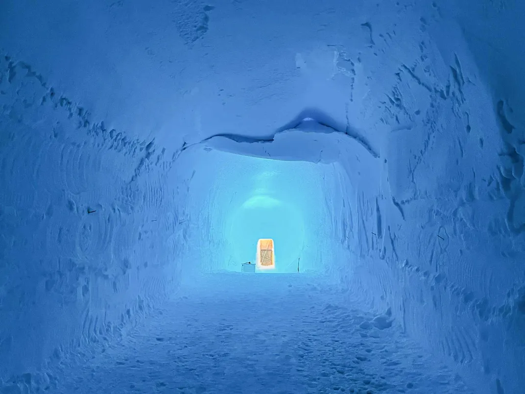 view through an ice tunnel with light at the end