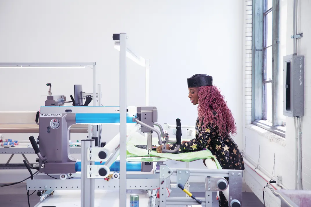 a woman using a sewing machine