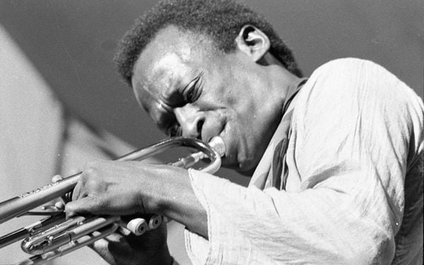 [Miles Davis], 1967. Robert Houston. Collection of the Smithsonian National Museum of African American History and Culture, Gift of Robert and Greta Houston, © Robert Houston. </p> <p> <b>Miles Davis b. May 1926 – d. September 1991 </b><br /> Playing with greats like Charlie Parker and John Coltrane, nurturing careers of legends like Herbie Hancock, and creating a wildly diverse opus of music that gave the world <i>Kind of Blue, Sketches of Spain,</i> and <i>Bitches Brew,</i> along with jazz sub-genres like post-bop and fusion, Miles was the genius whose trumpet continuously pushed jazz into new realms.