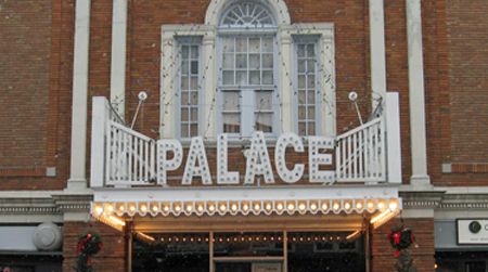 Reg Clark, owner of the Palace Theater in Lake Placid, accepts a plaque recognizing the theater as an RVSP cultural landmark from TAUNY executive director Jill Breit.