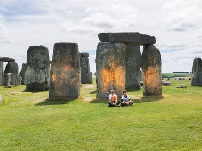 Climate Activists Spray Stonehenge With Orange Paint image