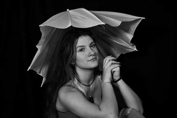 A girl and a broken umbrella thumbnail
