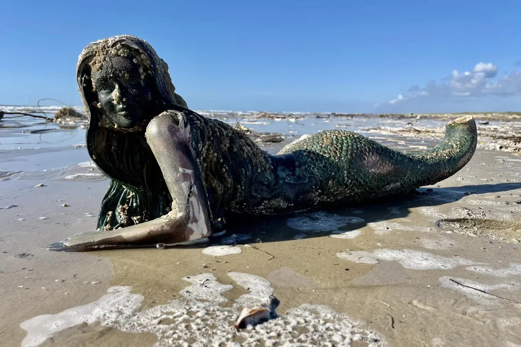 Fiberglass mermaid on the beach
