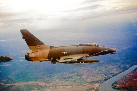 An F-100D—the same aircraft in the National Air and Space Museum collection—flies over the Mekong Delta, circa 1968.