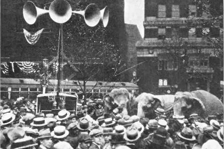Crowd outside the 1924 Republican National Convention in Cleveland listen to speeches broadcast from inside the hall via an early “public address system.”