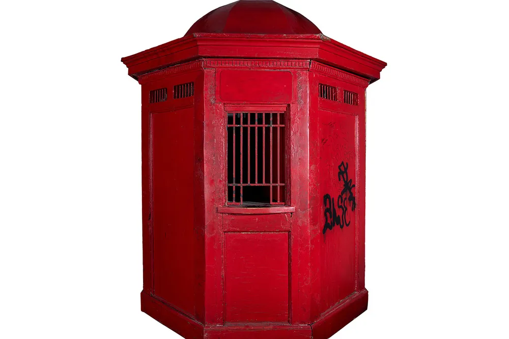 Red ticket booth with octagonal roof