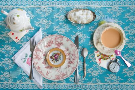 A tea party. Inspired by Lewis Carroll's Alice's Adventures in Wonderland: "Alice looked all round the table, but there was nothing on it but tea."
