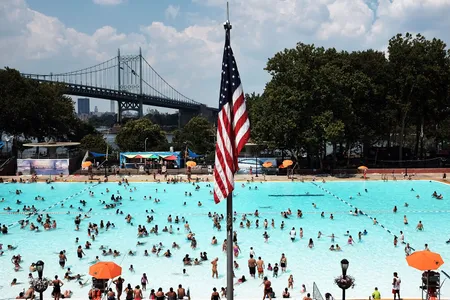 People enjoy a hot afternoon at the Astoria Pool in the borough of Queens on August 17, 2015, in New York City.