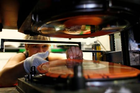 A new record comes off the press machine at the GZ Media factory in Lodenice, Czech Republic in 2013
