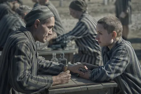 Lali (played by Jonah Hauer-King) and Gita (Anna Pr&oacute;chniak) in &quot;The Tattooist of Auschwitz,&quot; a new mini-series based on Heather Morris&#39; 2018 novel of the same name