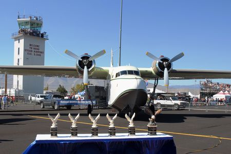 The eagles have landed. National Aviation Heritage trophies are lined up in front of the airplane that won the 2013 People’s Choice Award as well as a trophy in the large airplane category: a 1954 Grumman G-111 Albatross, owned by Joe Duke of St. Augustine, Florida.