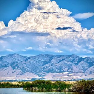 Creation Creates, billowing clouds over the mountain tops.  Overlooking Cache Valley, Utah. thumbnail