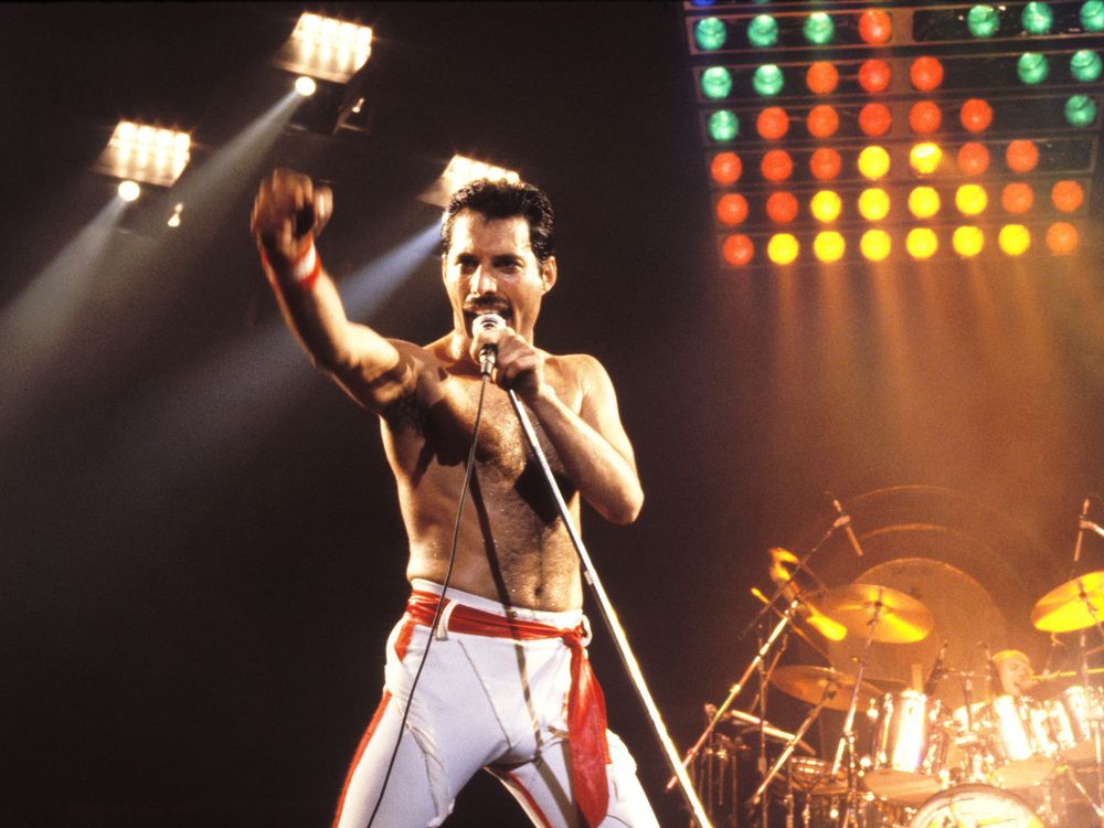 Freddie Mercury performing on stage with Queen in Oakland, California, 1982