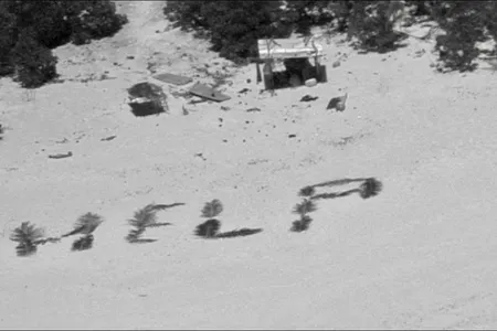 Crew aboard a U.S. Navy P-8 Poseidon aircraft spotted the men&#39;s &quot;HELP&quot; sign from the air.