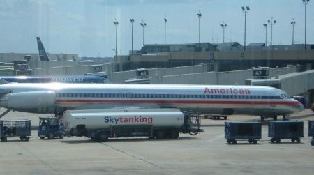 A large passenger jet refueling. Such planes may consume five gallons of fuel per mile traveled. But is it possible that they’re more efficient than cars?