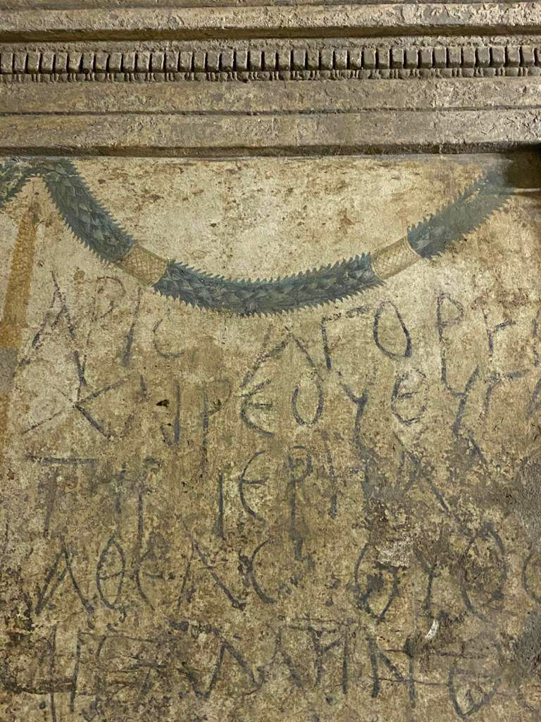 Ancient Greek names scrawled on the walls of the tombs