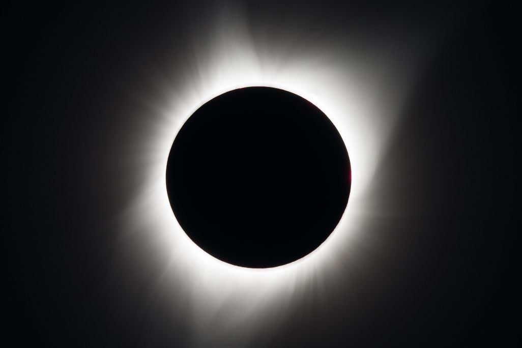 Black circle with a ring of light around it
