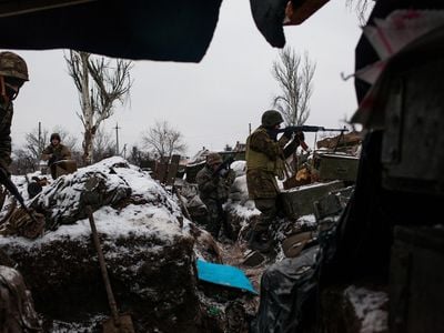 Members of Sich Battalion, a pro-Ukrainian volunteer force formed in 2015, provide cover fire for returning comrades who have fired an anti-tank rocket in a once-prosperous suburb of Donetsk. Volunteer units have since been integrated into the Ukrainian Armed Forces.
