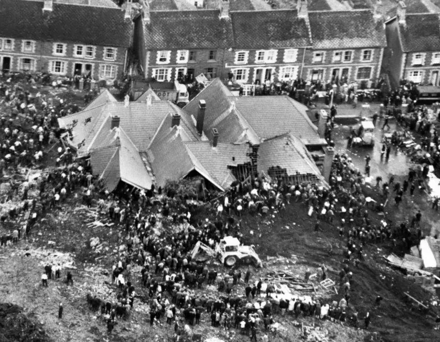 Rescuers search the rubble of a school in Aberfan, Wales, after a deadly mining accident in October 1966.
