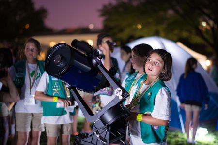 Girl Scouts can earn badges in space sciences by learning about astronomy and recreating scientific experiments.