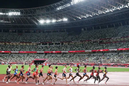 Olympic runners compete during the 10,000 meters race in Tokyo. In ancient times, running was likely used to push animals to exhaustion during hunting.
