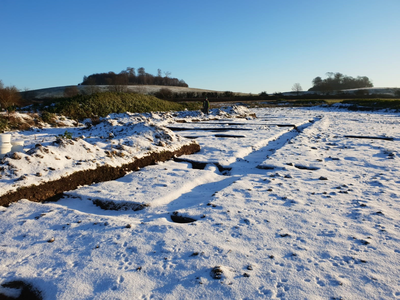 Snow-covered outline of the Roman villa's foundations