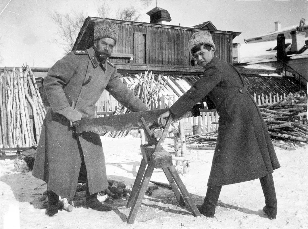 Nicholas and Alexei sawing wood in Tobolsk in 1917